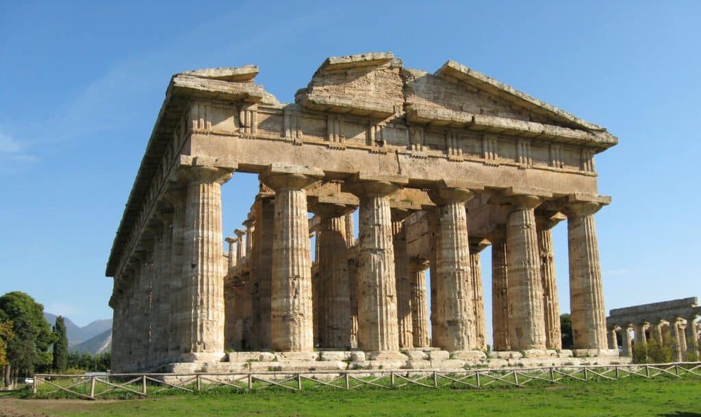 Temple of Hera II, in the doric style, has 6 columns on the facade and 14 along the long side of the structure.