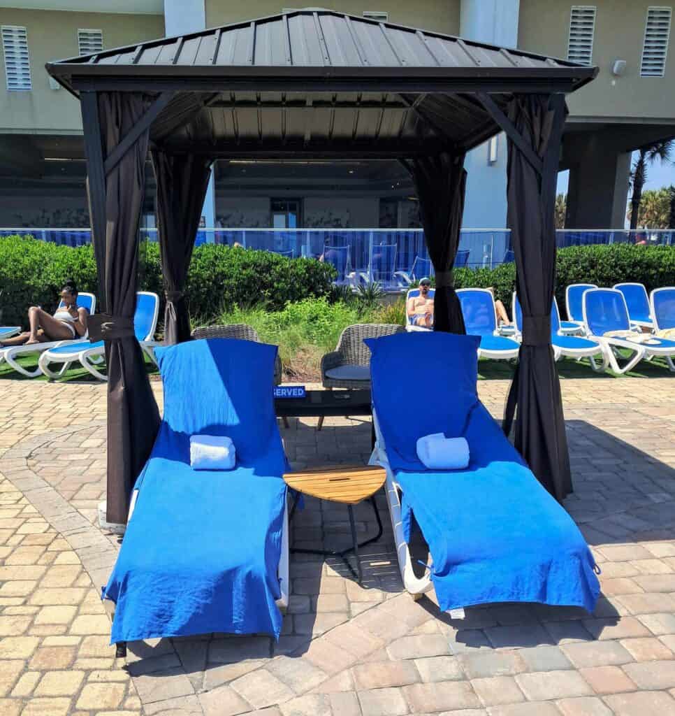 Private cabana with lounge chairs at the Hilton Ocean 22.