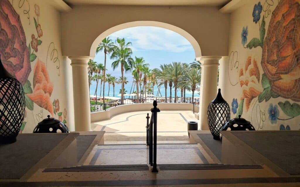 Open air walkways at the Hilton Grand Vacations Los Cabos with steps to the pool and sea.