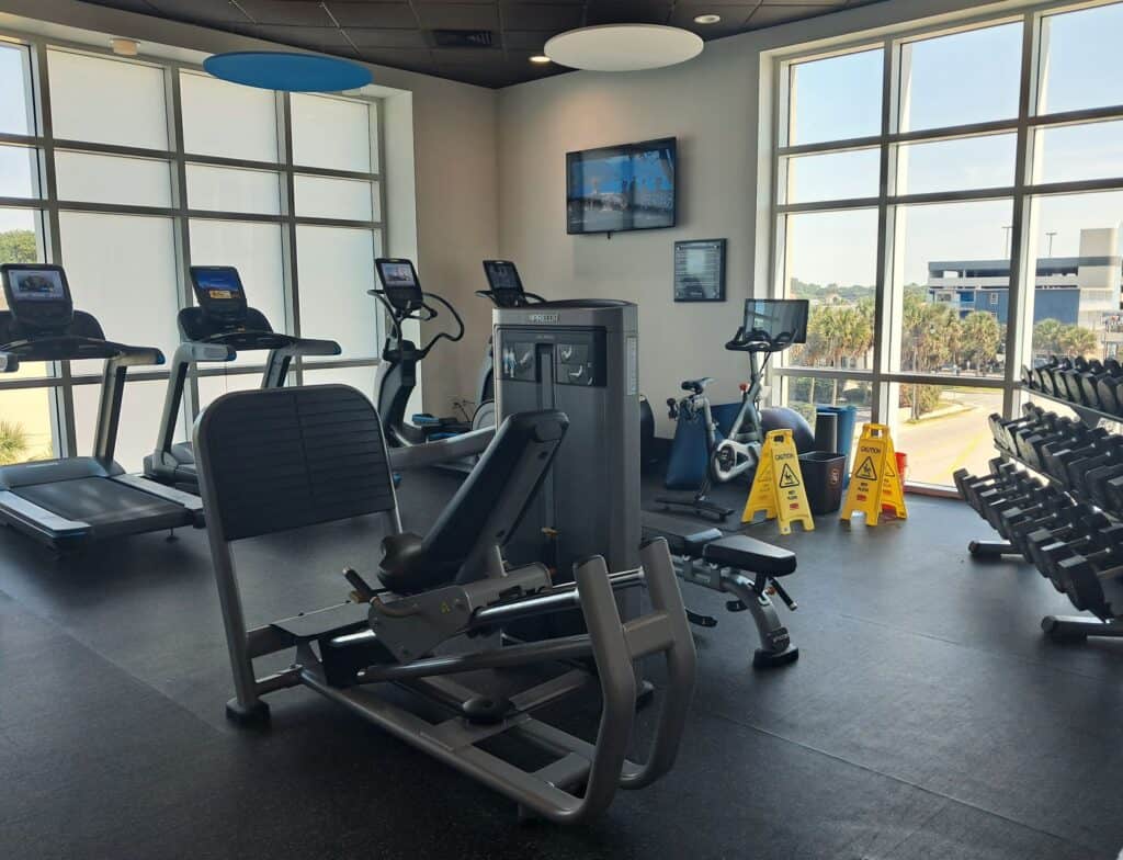 Fitness center with treadmills, weights, and other euipment.