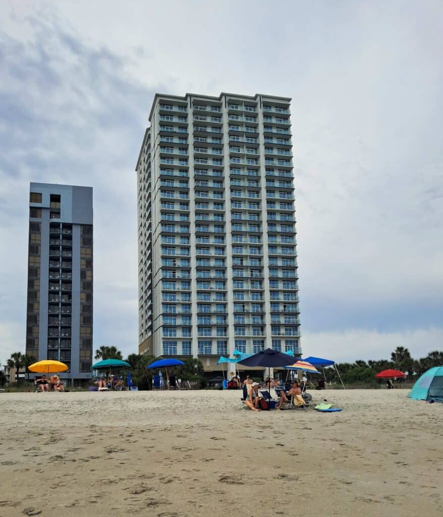 View of the Hilton Ocean 22 high rise building from the beach.