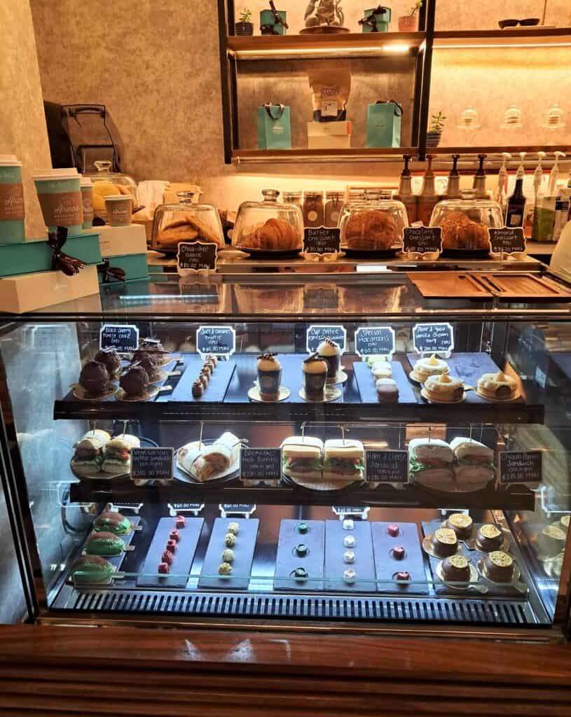 Counter in coffee shop with pastries, sandwiches and chocolates at the Hilton Los Cabos.