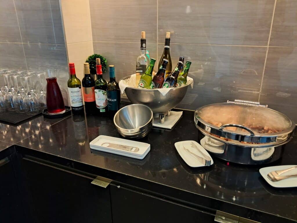 Wines and hot appetizers in the Owners Lounge during Happy Hour.