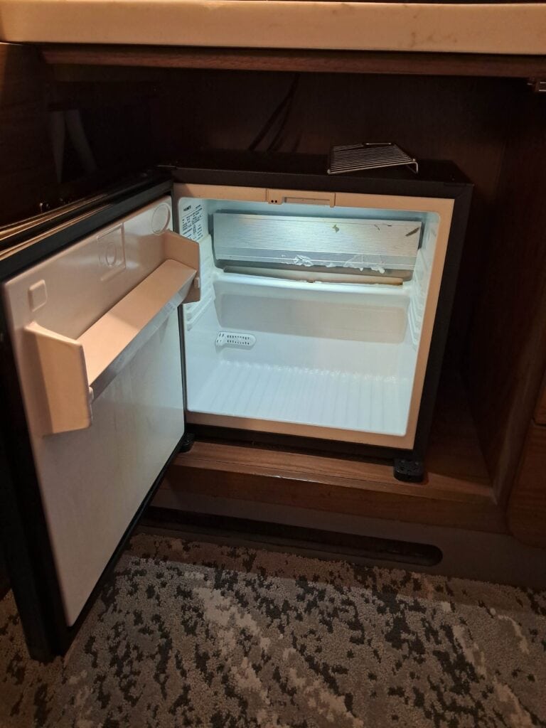 Inside view of the mini fridge in the Residences by Hilton Club studio room.