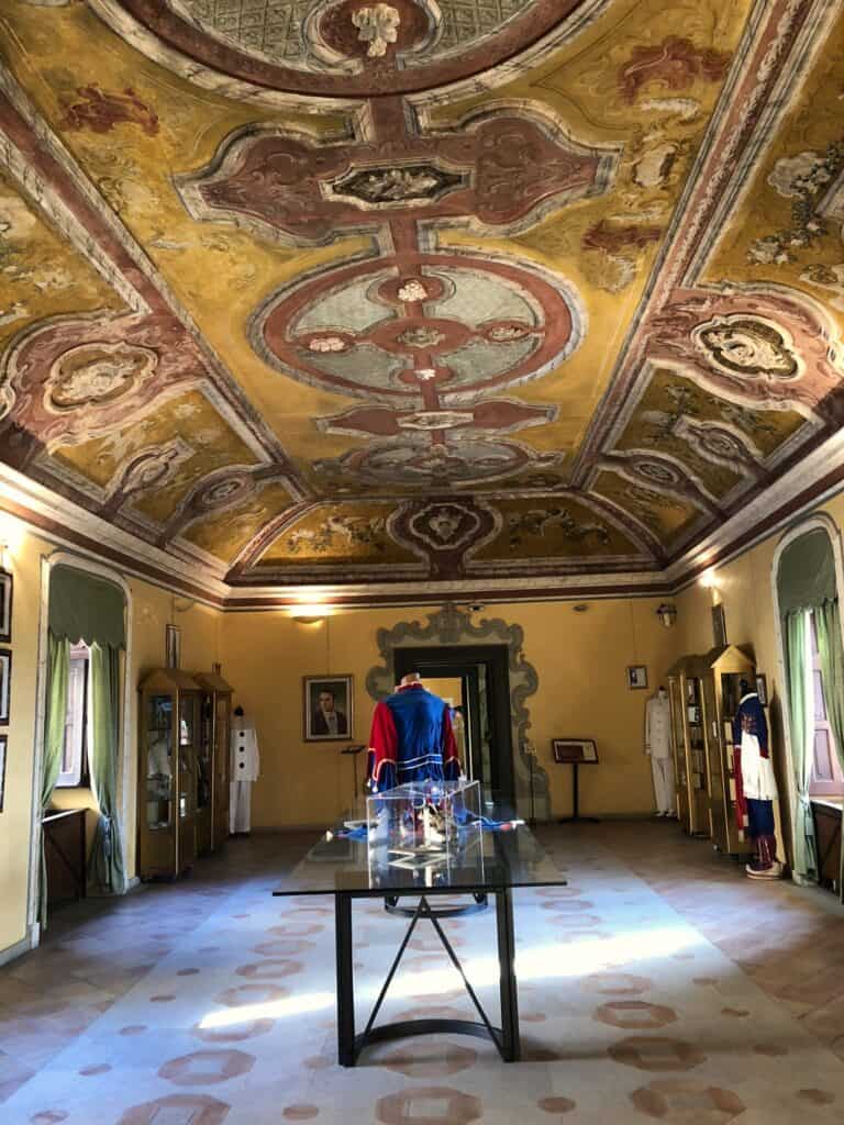 Room with ornate ceiling and artifacts from ancient times in the Archaeological Museum of Santa Severina.