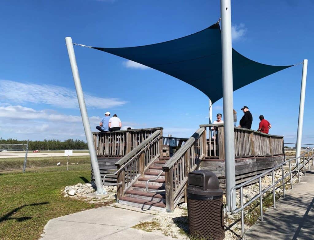 Observation deck at the Naples Airport with a cover over the viewing area.