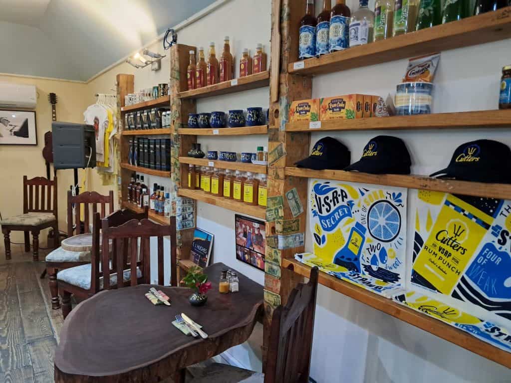 Interior of tables and products lining the wall in Cutters of Barbados.
