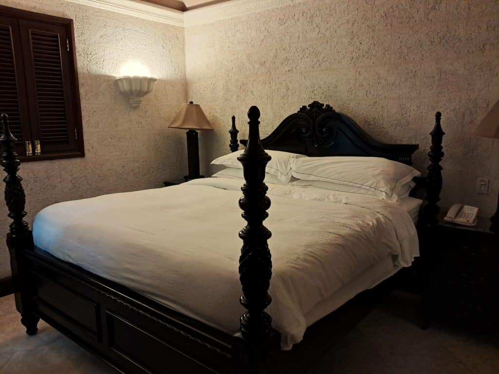 Four poster king size bed in main bedroom in The Crane Resort villa.