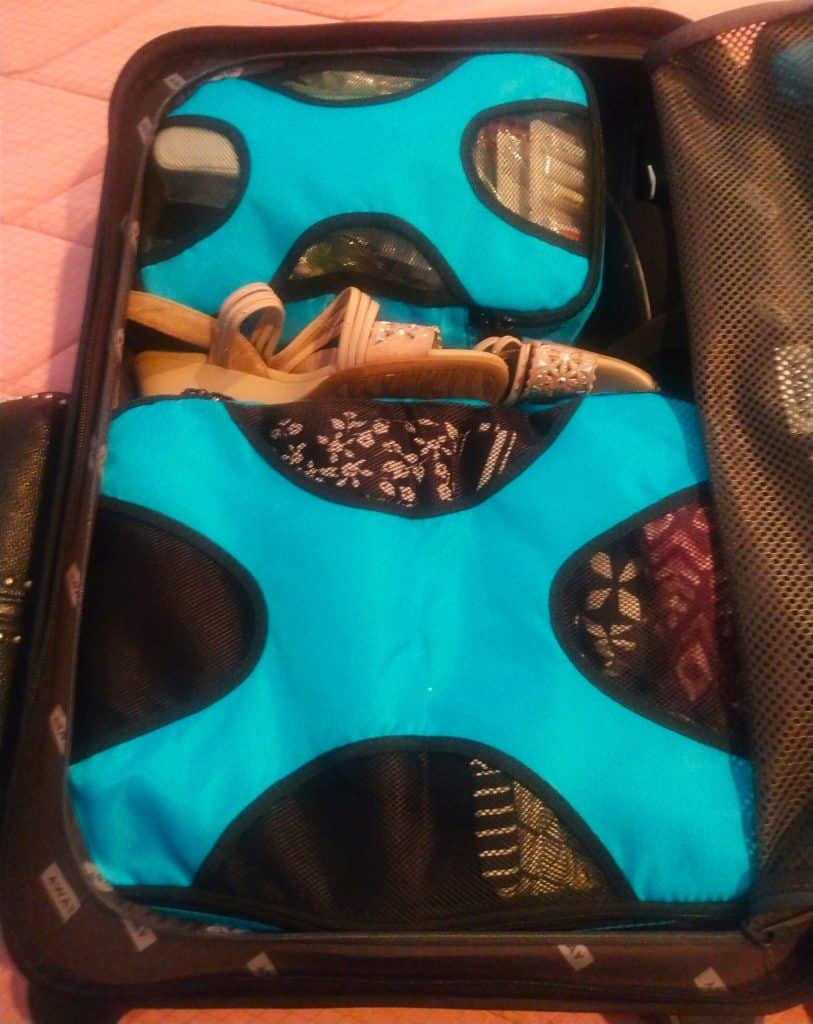 Two packing cubes inside a carry-on suitcase for a trip to Naples Florida.