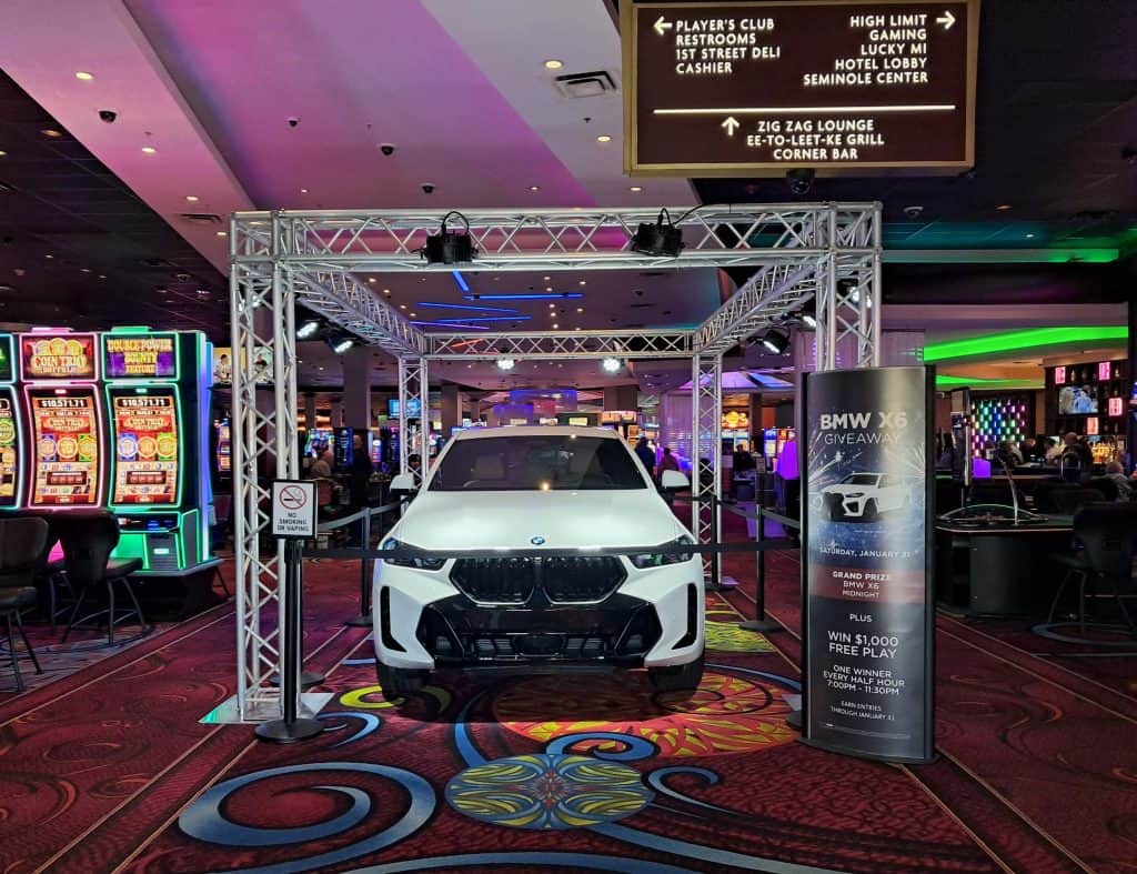 Car on display at entrance to Seminole casino on a rainy day in Naples Florida.