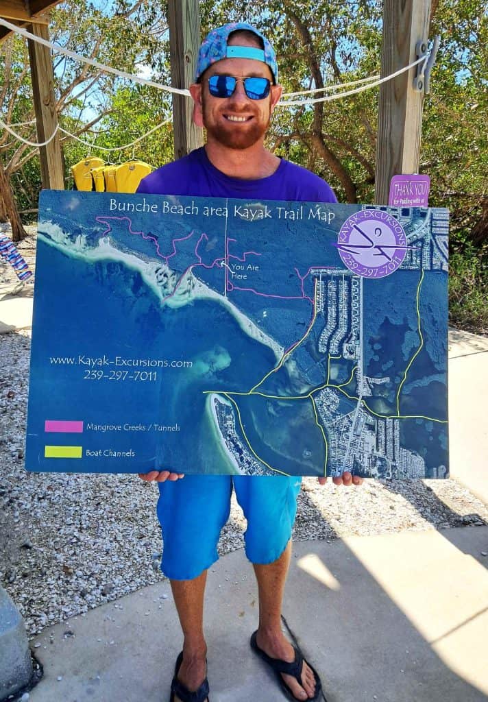 Maxwell holding a kayaking map.
